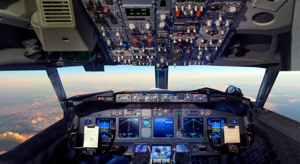 cockpit airplane flying above tropical sunset - cockpit airplane autopilot dashboard imagens e fotografias de stock