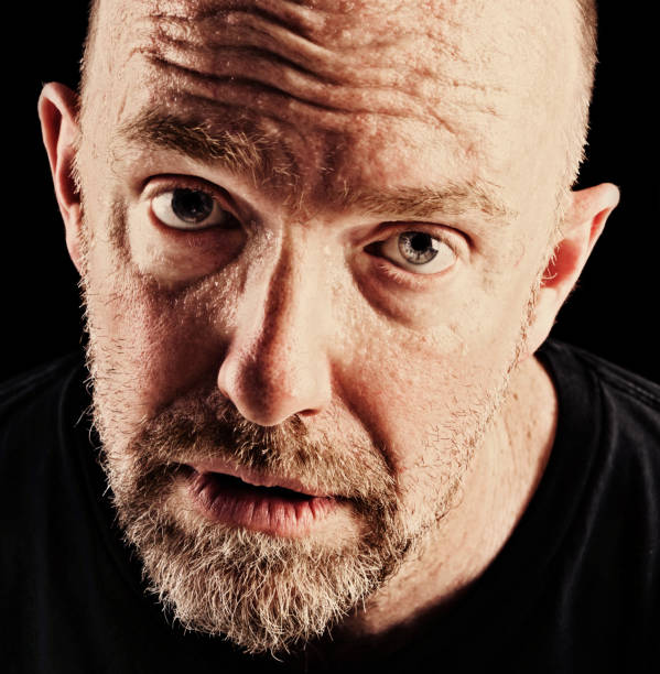 istock Miserable mature man stares at camera sadly 850653560