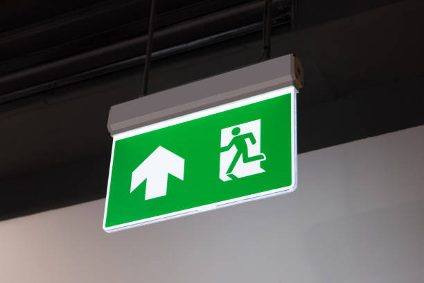 istock green emergency exit sign showing the way to escape 850653954