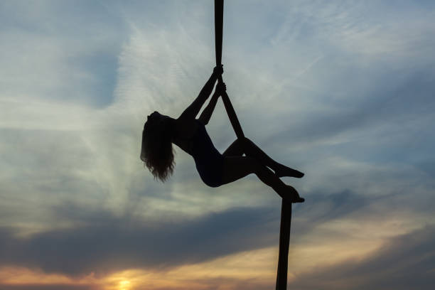 istock Woman climbs up the rope. 850663696