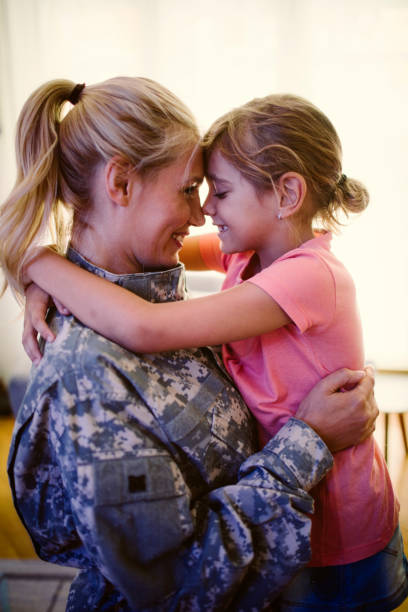 istock Army Mom With Her Little Girl 850669384