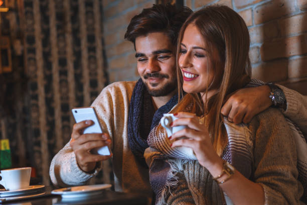 istock Beautiful young couple drinking coffee in cafe. 850669820