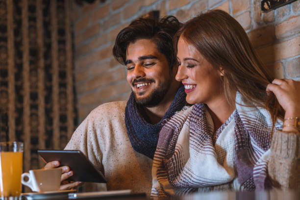 istock Beautiful young couple drinking coffee in cafe. 850676396