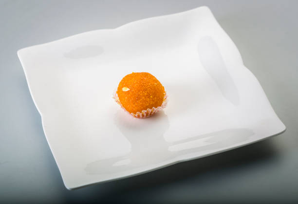 Laddu or laddoo are ball-shaped sweets popular in the Indian subcontinent. Laddus are made of flour, minced dough and sugar with other ingredients that vary by recipe. They are often served at festive or religious occasions.