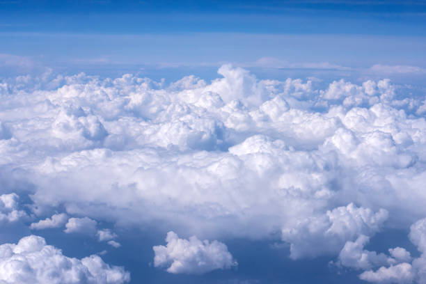 istock View of blue sky above the clouds from airplane window 850677324
