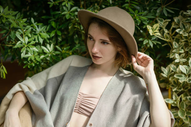 istock Young woman wearing in hat and poncho. 850680316