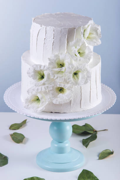 istock White bunk wedding cake decorated with flowers 850680440