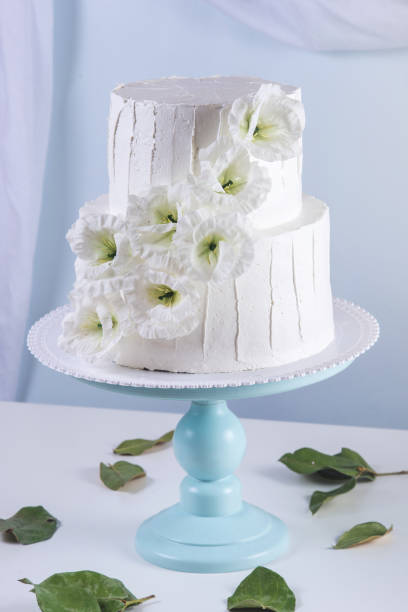 istock White bunk wedding cake decorated with flowers 850680456