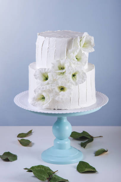 istock White bunk wedding cake decorated with flowers 850680458