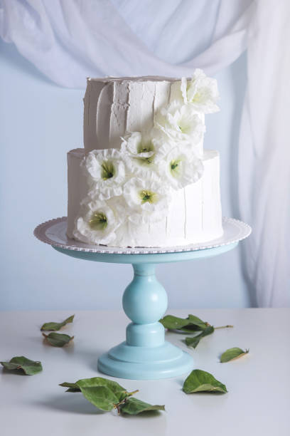istock White bunk wedding cake decorated with flowers 850680462