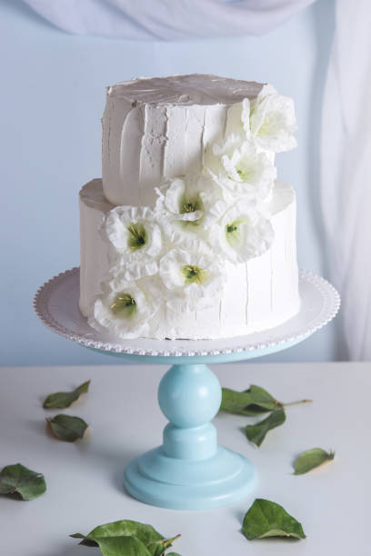 istock White bunk wedding cake decorated with flowers 850680482