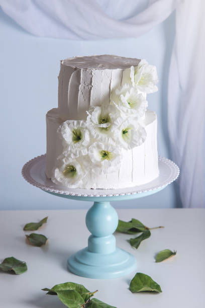istock White bunk wedding cake decorated with flowers 850680510