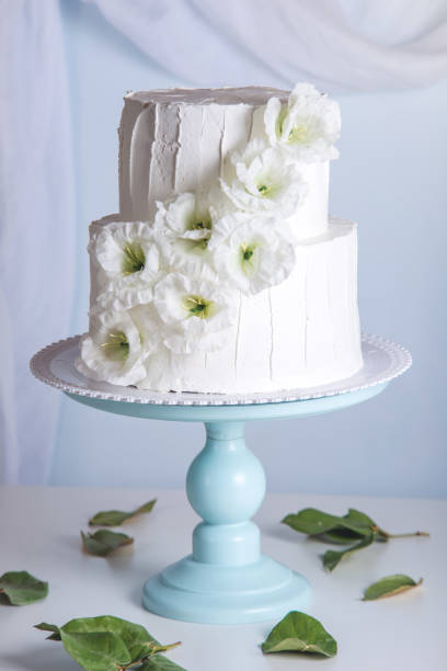 istock White bunk wedding cake decorated with flowers 850680840