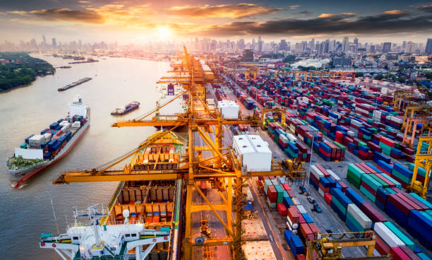 istock Logistics and transportation of Container Cargo ship and Cargo plane with working crane bridge in shipyard at sunrise 850684232
