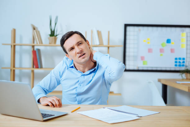 istock Tired brunette touching his neck 850685402