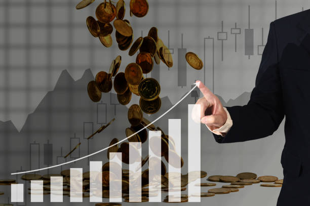 istock Double exposure businessman hand touching virtual panel of growth bar chart on financial graph chart and falling gold coins background. 850685510