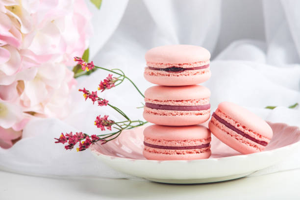 istock Pink strawberry macarons. French delicate dessert for Breakfast 850685552