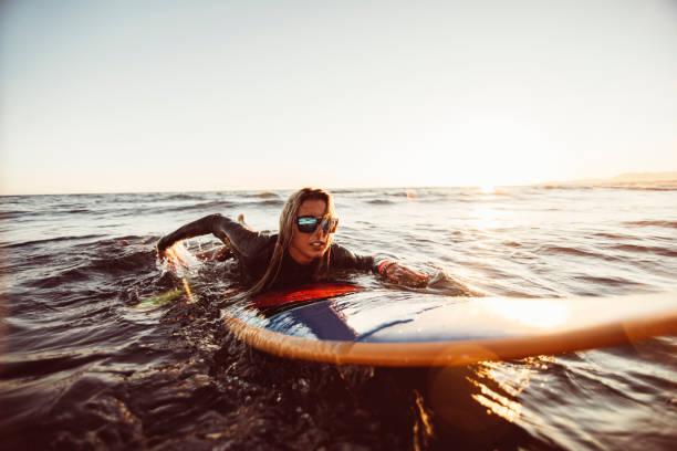 istock Swimming on a surfboard 850688318