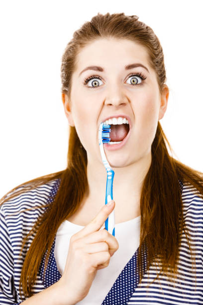 istock Woman brushing cleaning teeth. 850688736