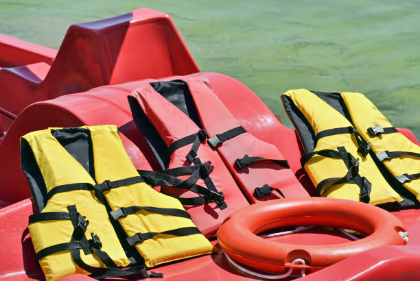 rubber jackets and lifesaver - buoy horizontal lake sailing imagens e fotografias de stock