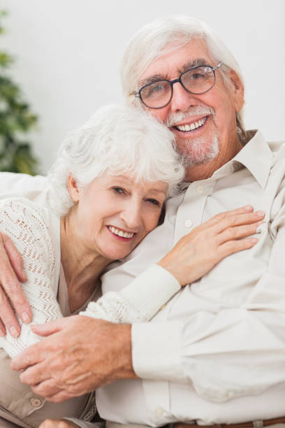 istock Couple embracing on couch 850693466