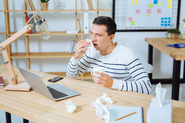 istock Sick brunette male going to sneeze 850695588