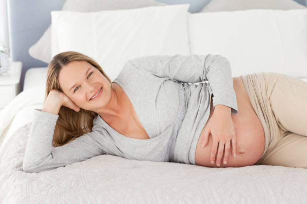 istock Happy future mom touching her belly 850696312
