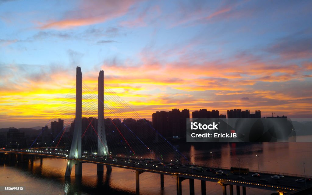 Huizhou Sunset & Hesheng Bridge Sunset view over the East River and Hesheng Bridge in Huizhou City. Huizhou is a city in southeast Guangdong Province, China and part of the Pearl River delta. Asia Stock Photo