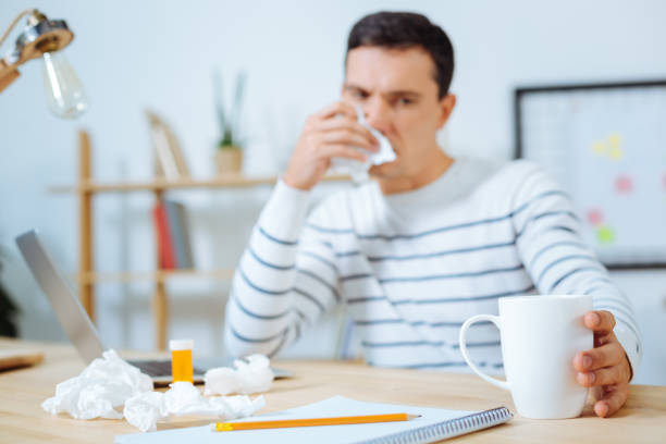 istock Frustrated brunette wiping his nose 850704830