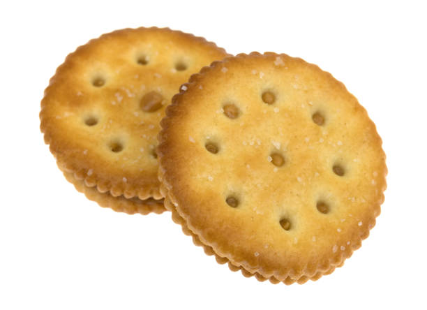 istock Two roasted peanut butter crackers on a white background 850712644