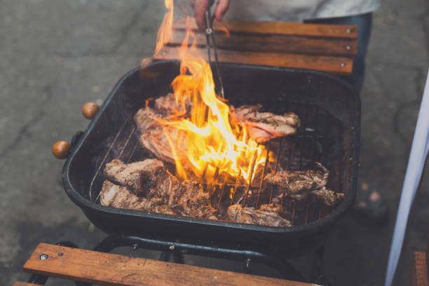 istock Grill steaks on metal grate with flame, barbecue 850716842