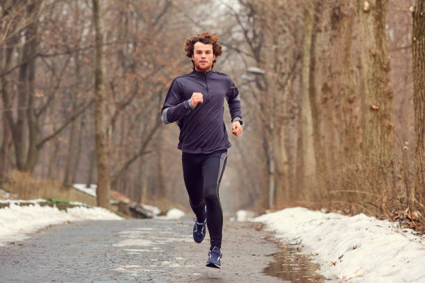istock A young male runner runs in the park. 850756846