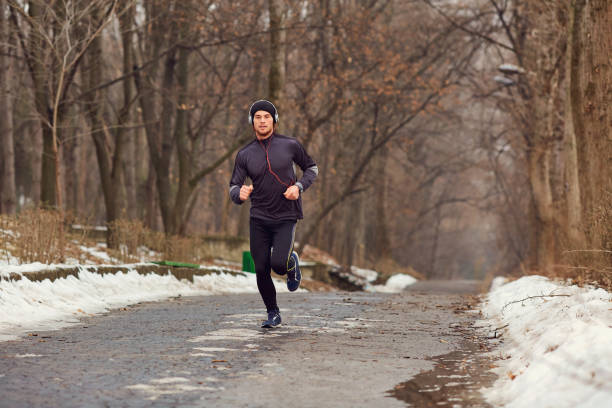 istock A young male runner runs in the park. 850757068
