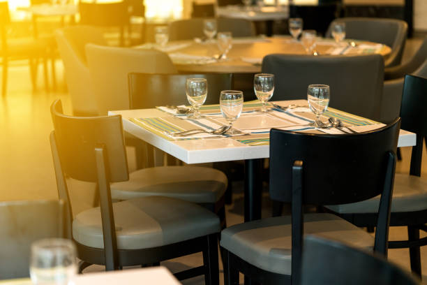 istock Chairs and counters, coffee shop bar, table seat, dining table in the restaurant has a plate of cutlery, a glass of water, and a decorative mat for the table. 850759554