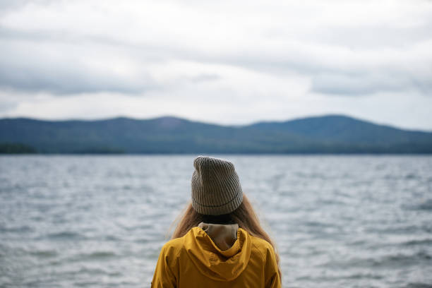 istock Woman looking towards horizon 850763712