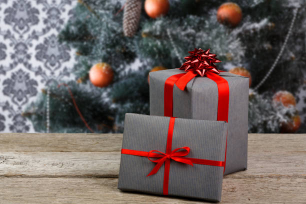 istock Christmas presents on decorated tree background, holiday concept 850767576