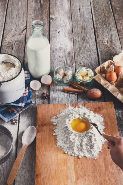 istock Woman baker makes dough with eggs, butter and flour 850768702