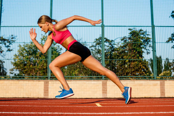 istock Runner sprinting towards success on run path running athletic track. Goal achievement concept 850790158