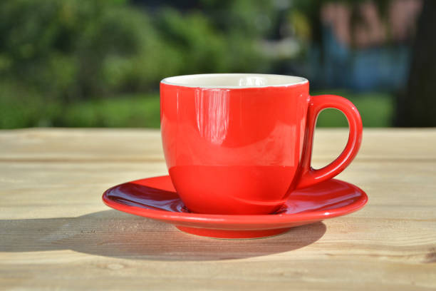 istock Coffee in red cup in garden 850790694