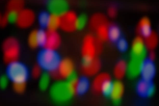 istock Christmas background of colorful glowing lanterns on black backg 850791178