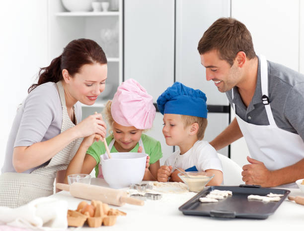 istock Adorable family baking together in the kitchen 850791316