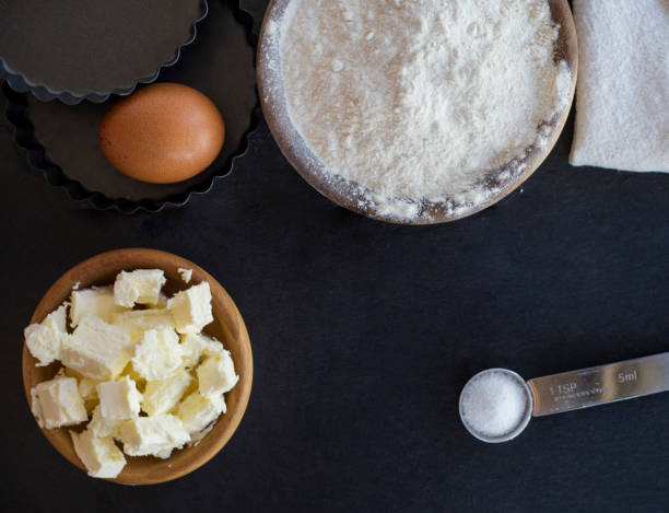 istock flour and ingredients on black table. Top view 850801416