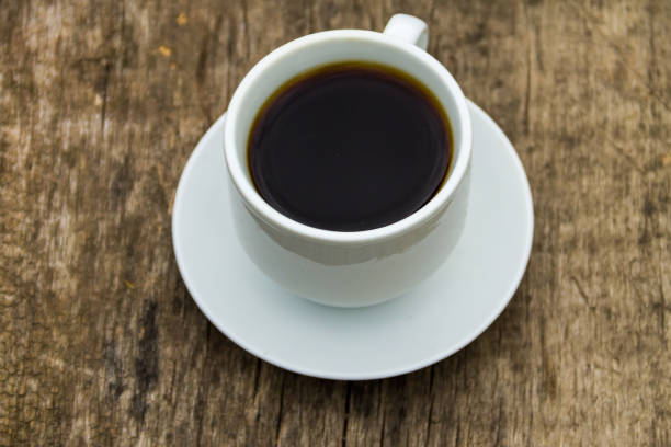 istock Cup of coffee on wooden table 850801946