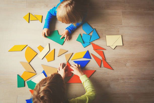 istock kids playing with puzzle, education concept 850808454