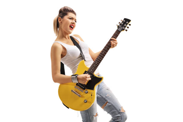Punk girl playing an electric guitar isolated on white background