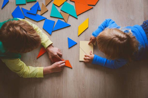istock kids playing with puzzle, education concept 850808944