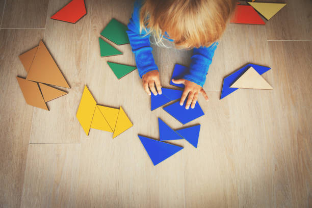 istock little girl playing with puzzle, early child development 850811826