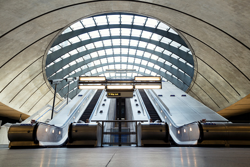 Escalators at Canary Wharf underground station, London, UK.