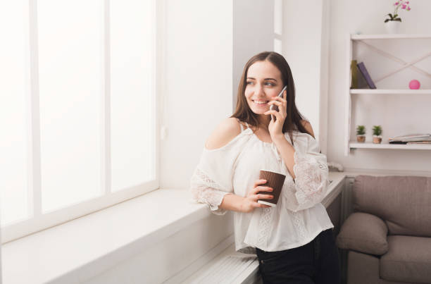 istock Happy woman talking on mobile phone 850816382