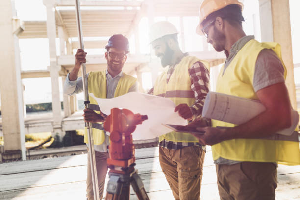 istock Portrait of construction engineers working on building site 850817336